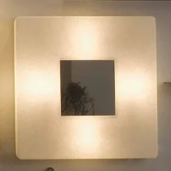 Lampada con specchio a muro di design In-es.artdesign Ego in nebulite