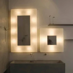 Lampada con specchio a muro di design In-es.artdesign Ego in nebulite